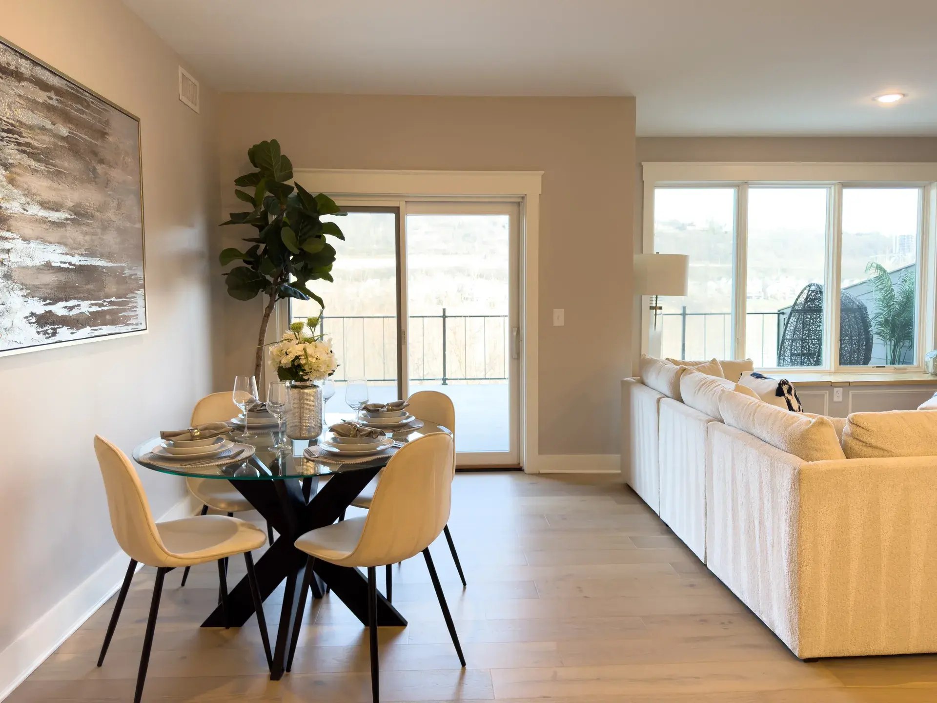 Elegant dining area opening onto a private balcony overlooking the Ohio River