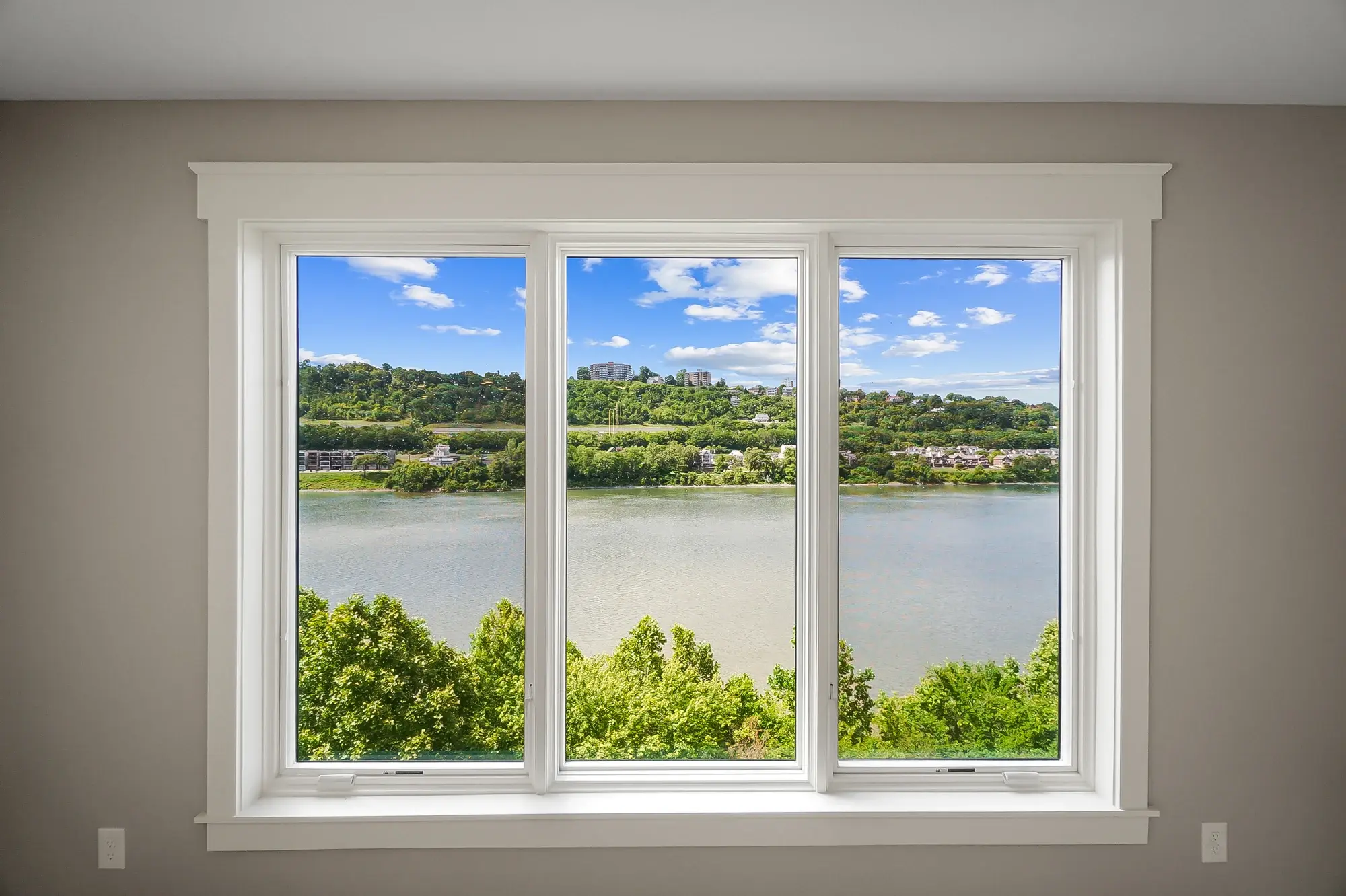 Panoramic river and city view from a private balcony at Manhattan Harbour
